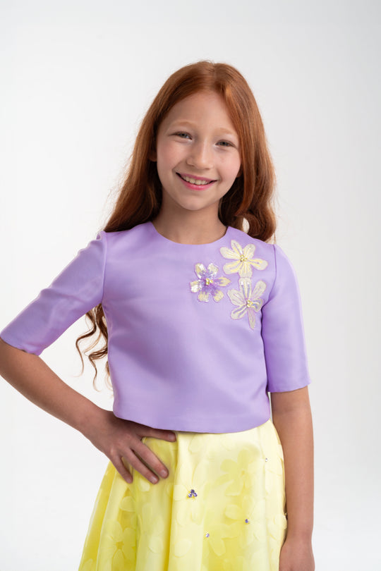 girls lavender top with floral yellow skirt